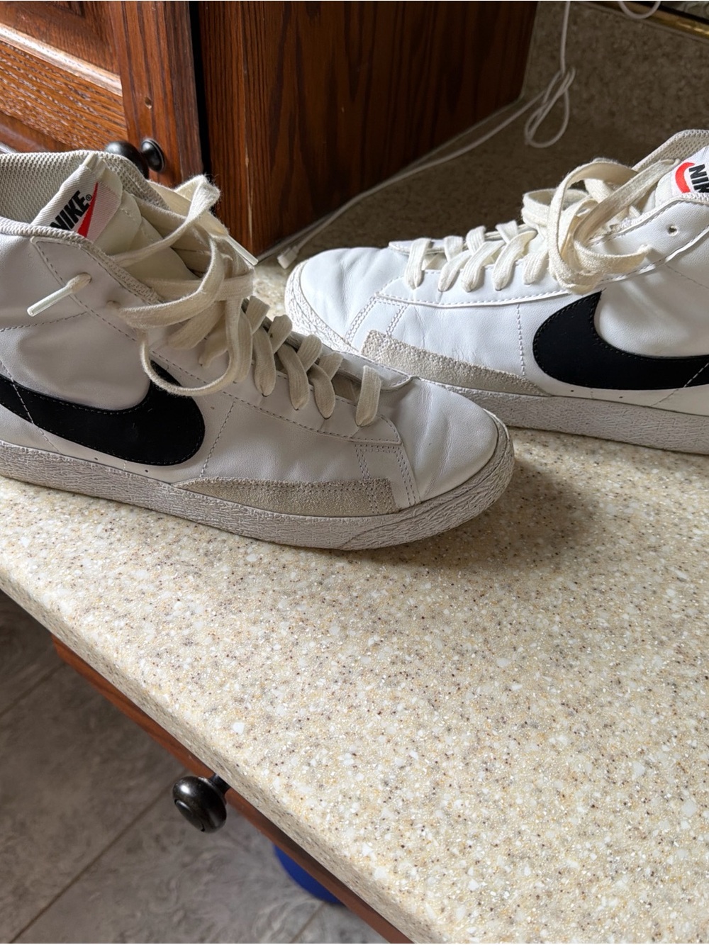 Nike High-Top Sneakers in White with Black Swoosh
